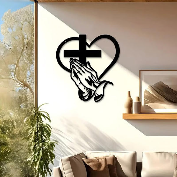 Praying hands  and metal cross